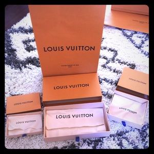 Louis Vuitton boxes with dust bags and store bag.